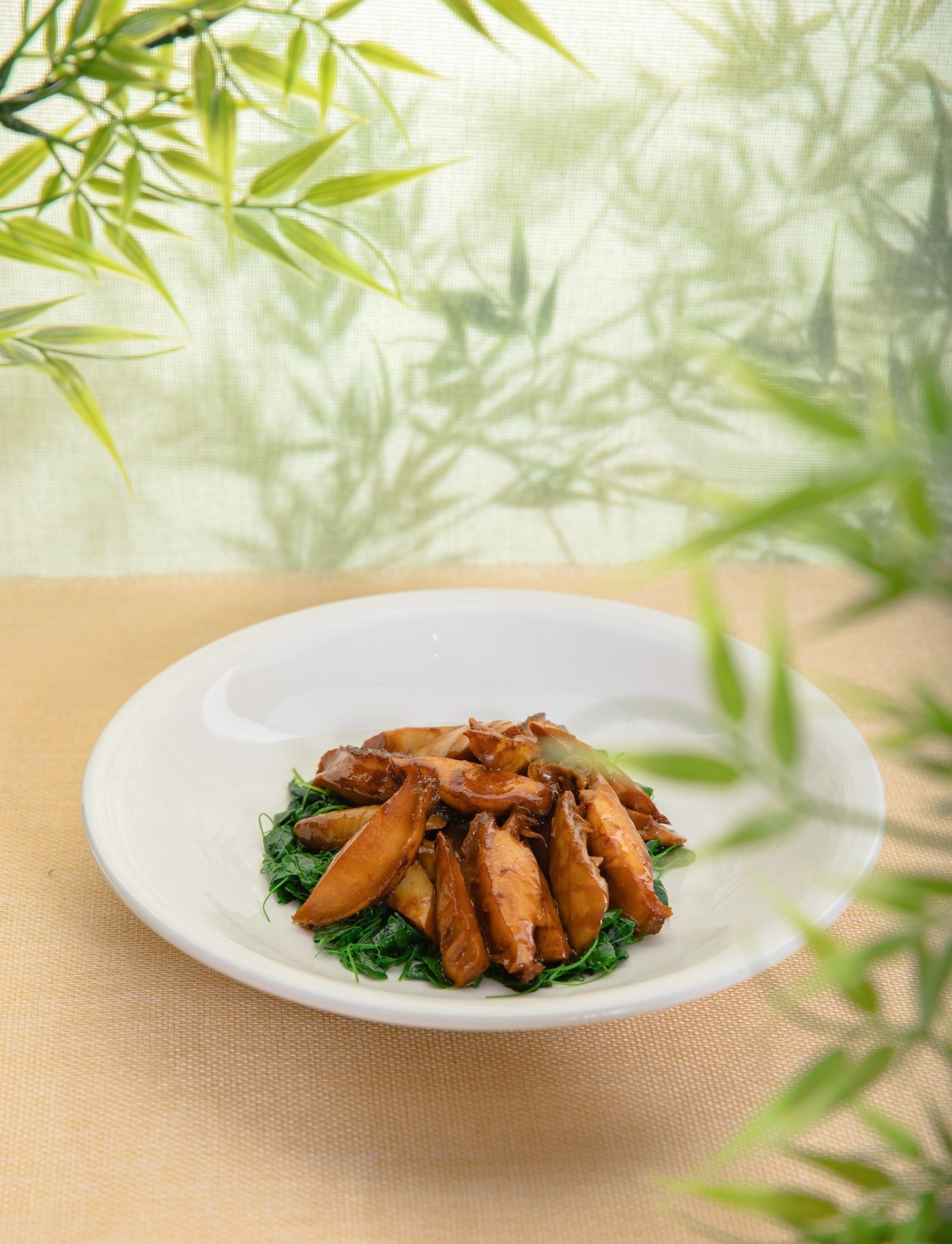 Braised King Oyster Mushrooms on Sauteed Greens