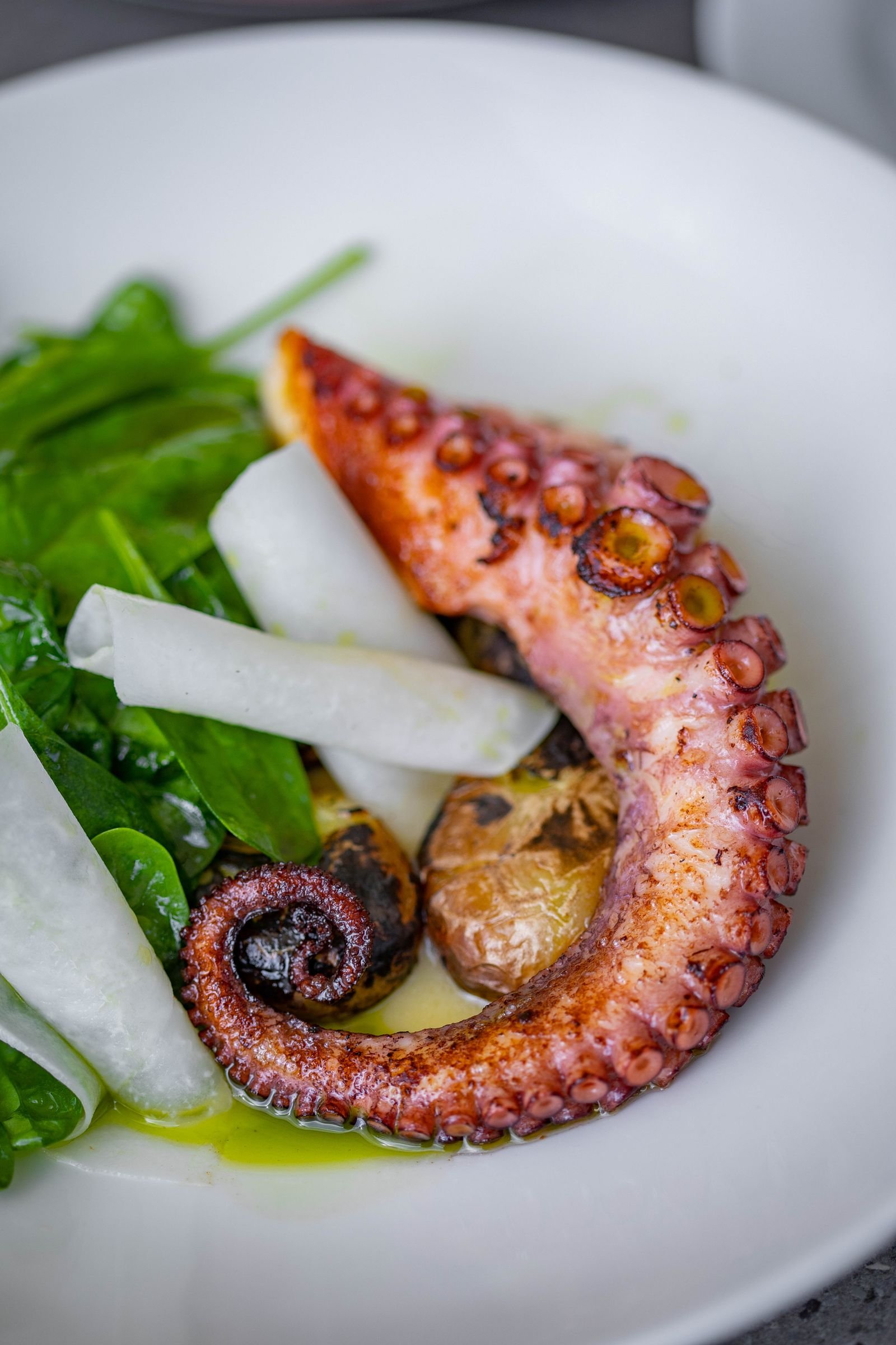 Charred Octopus with Baby Potatoes and Spinach
