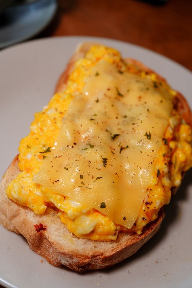 Cheesy Scrambled Eggs on Sourdough Toast