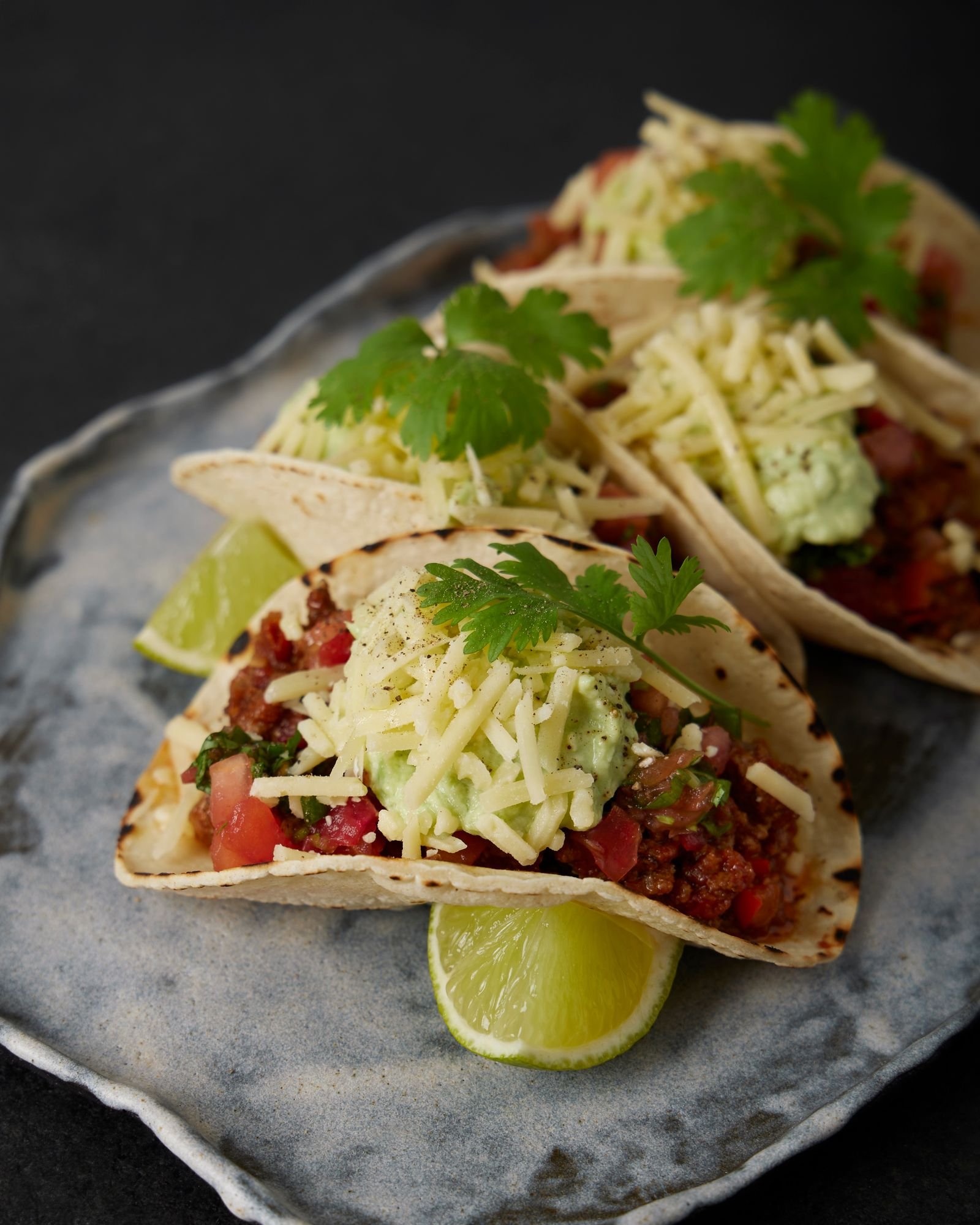 Ground Beef Tacos with Guacamole and Cheese