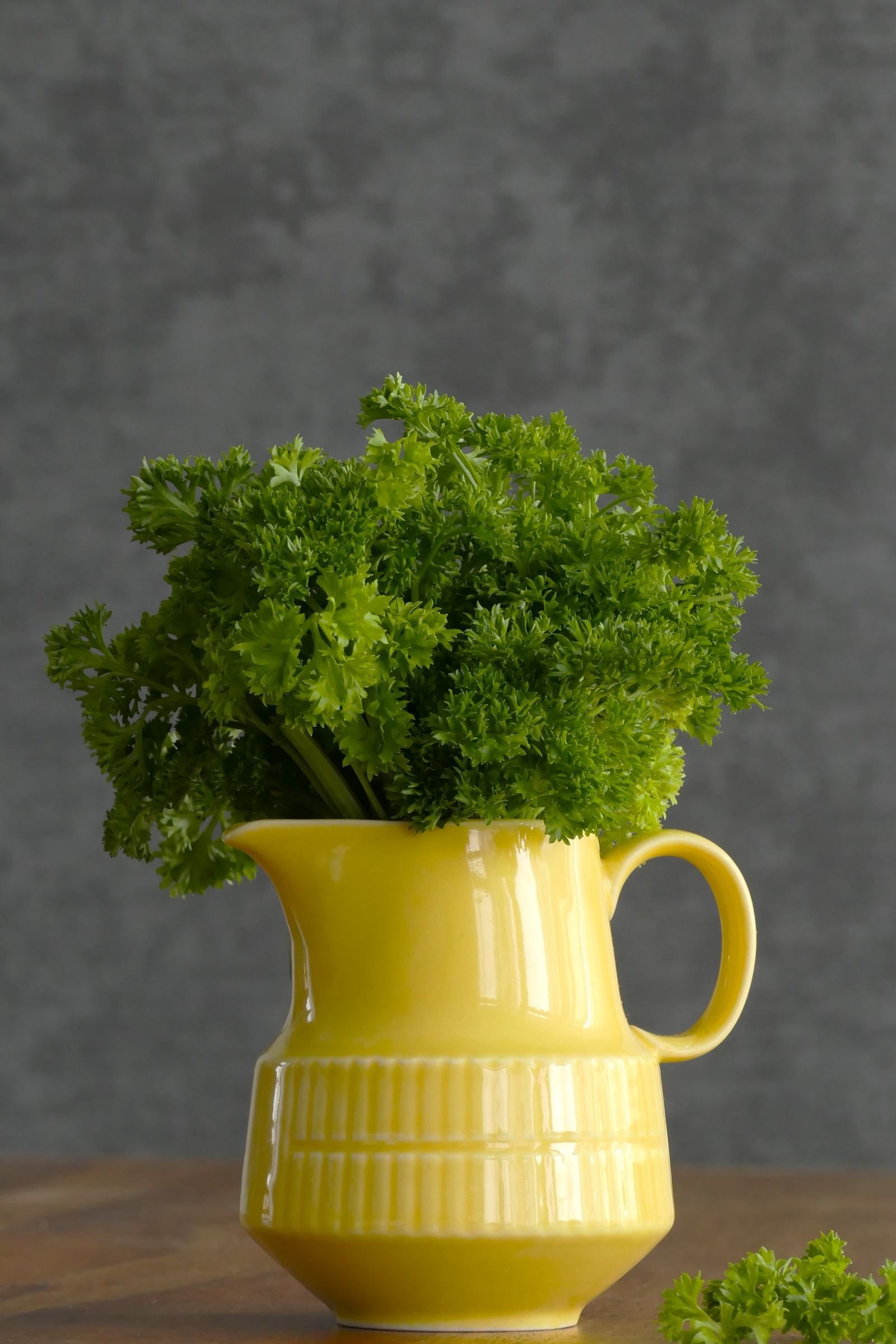 Fresh parsley in a yellow jug